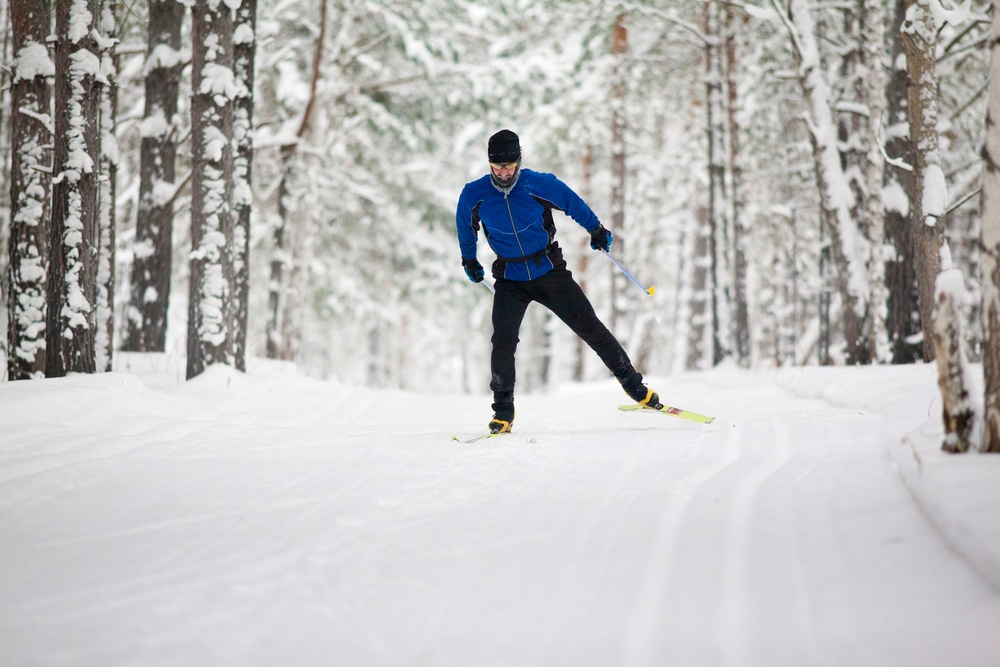 A Man cross-country skiing, one of the top-rated things to do in Minnesota in the winter